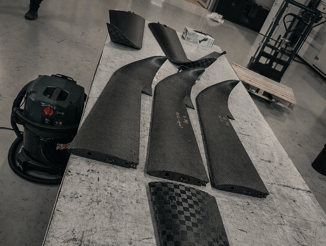 Carbon-fibre UAV prototype components prepared for fit and assembly testing